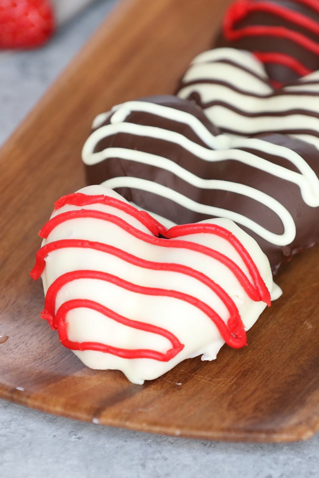 Heart-shaped chocolate covered strawberries.
