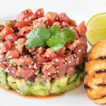 Tuna Tartar is loaded with delicious cubes of raw, sashimi-grade tuna that has been lightly seasoned. The tuna is placed atop creamy avocado for a flavor combo that’s out of this world.
