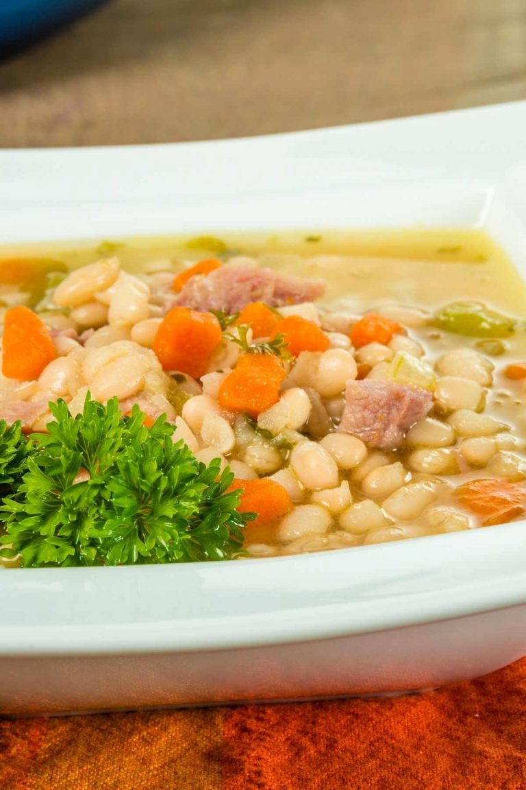 Inexpensive and hearty, ham and beans is the perfect way to use up your leftover ham! On a cool evening, this savory recipe will warm your family and have them asking for more.