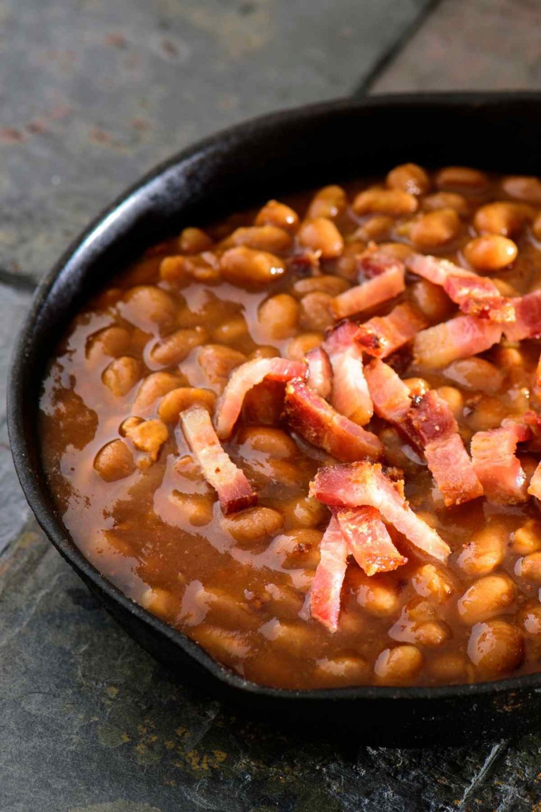 This simple stovetop dish is set to become your favorite Pork and Beans recipe! Full of delicious sweet and smokey flavors, it's the ideal side to serve at your next backyard BBQ!