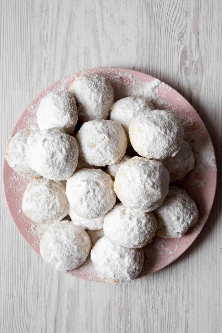 Snow Ball Cookies are soft, sweet, and delicious. They’re delicately flavored with vanilla, and the crushed pecans add a delicate crunch.