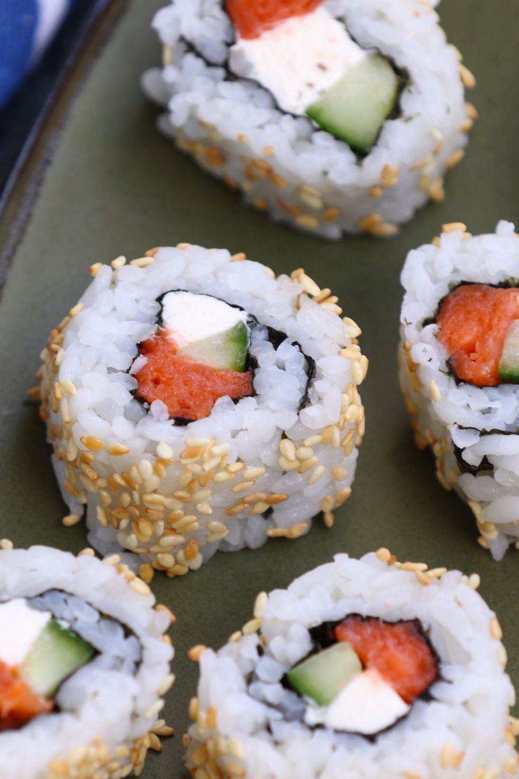 Philly Roll Sushi is filled with smoked salmon, cream cheese and cucumber, then rolled in nori seaweed sheet and sushi rice. In this recipe, you will learn how to make sushi rice, how to roll the sushi, and how to make the delicious and creamy Philadelphia roll.