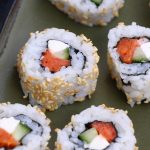 Philly Roll Sushi is filled with smoked salmon, cream cheese and cucumber, then rolled in nori seaweed sheet and sushi rice. In this recipe, you will learn how to make sushi rice, how to roll the sushi, and how to make the delicious and creamy Philadelphia roll.