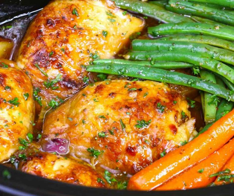 This Saturday Night Honey Garlic Chicken features succulent chicken thighs and vegetables in a sticky honey garlic sauce. It’s an easy crockpot chicken recipe that only needs 15 minutes of prep before the slow cooker goes to work.