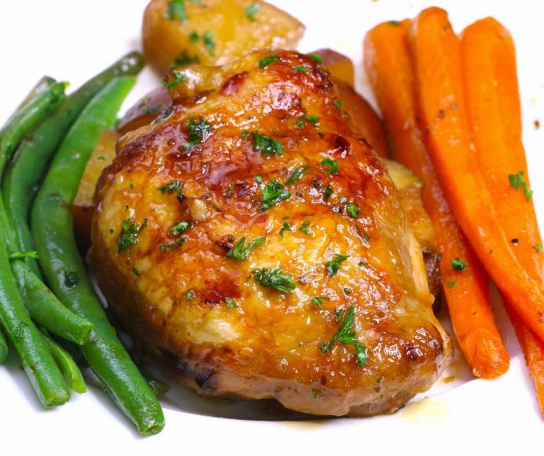 This Saturday Night Honey Garlic Chicken features succulent chicken thighs and vegetables in a sticky honey garlic sauce. It’s an easy crockpot chicken recipe that only needs 15 minutes of prep before the slow cooker goes to work.
