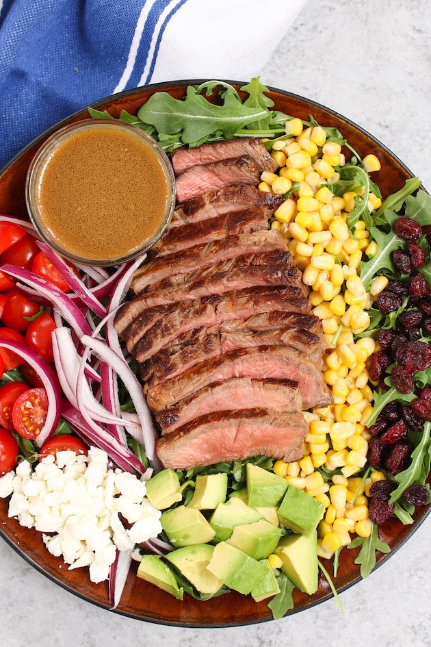 Light Dinner Steak Salad combines juicy, pan-seared steak with fresh vegetables and a balsamic vinaigrette dressing. It’s a perfect keto meal on its own, or can be served on pasta or wrapped in tortillas.