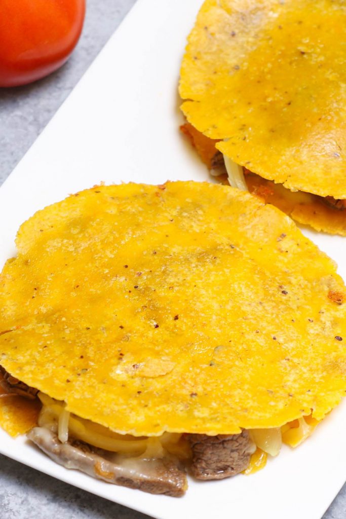 Mulita Taco is loaded with gooey melted cheese and a flavorful carne asada, with crispy tacos on both sides. Talk about mouth-watering Mexican comfort food everyone loves! It’s a double-deck quesadilla with two tortillas and meat on the inside.
